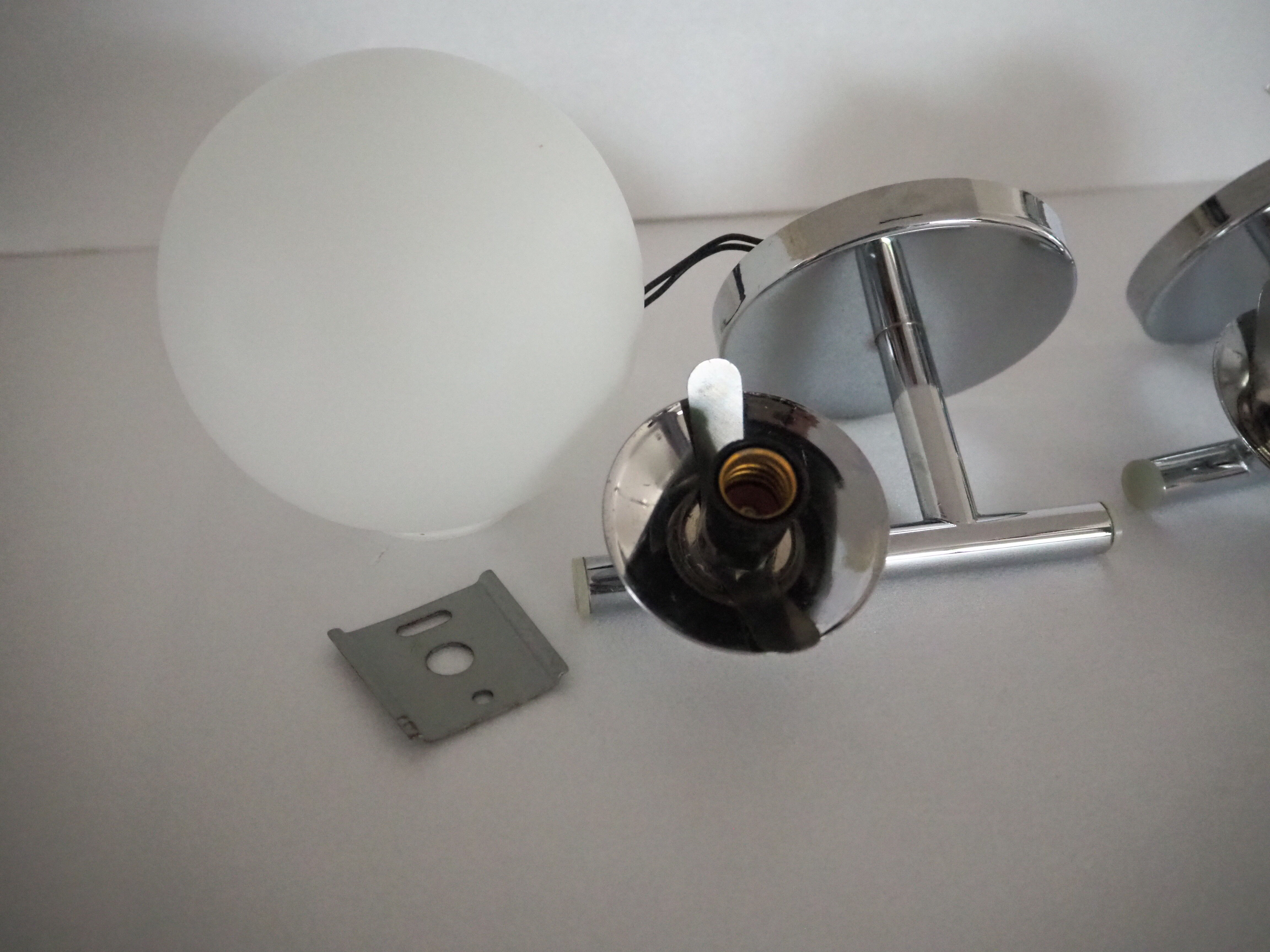 Pair of sconces with an opaline globe and chrome structure from the 1970s
