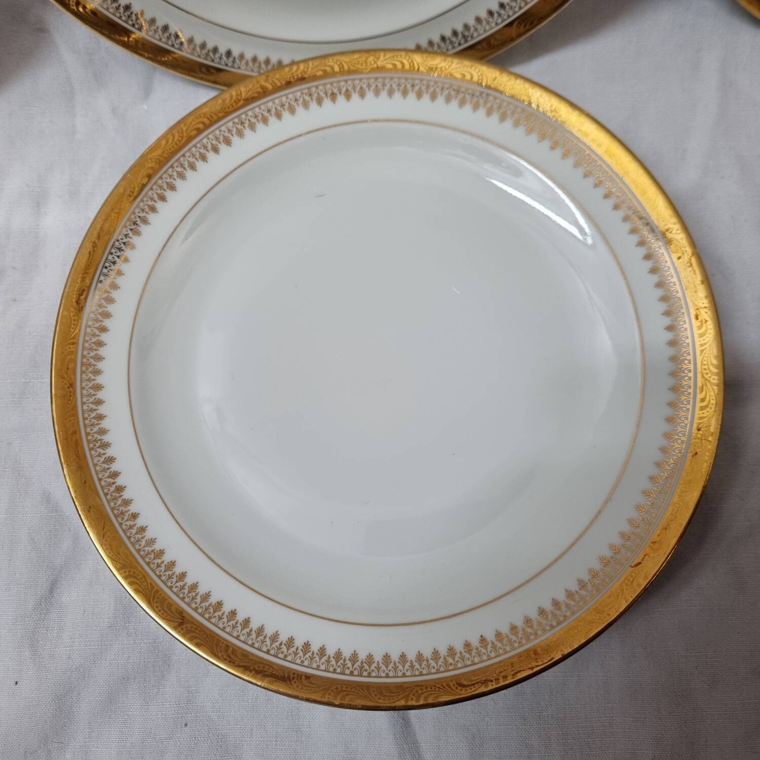 7 assiettes Limoges doré à l'or fin