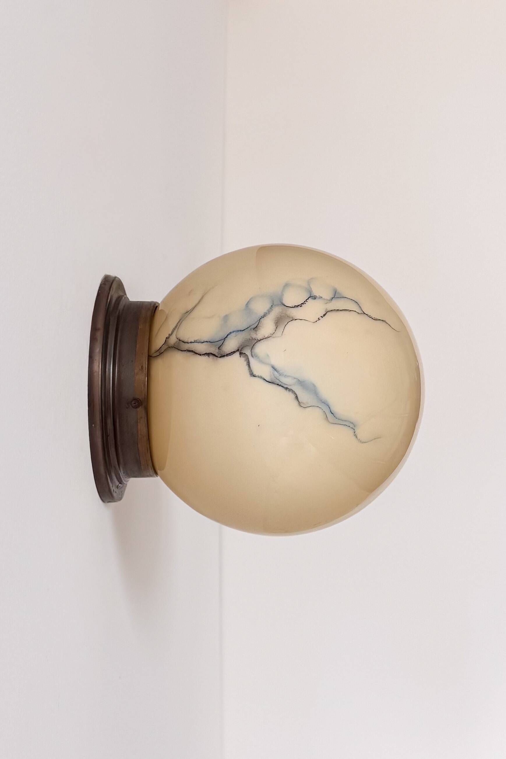 Pair of vintage wall lights, brass and "marbled" opaline, France, 1940.
