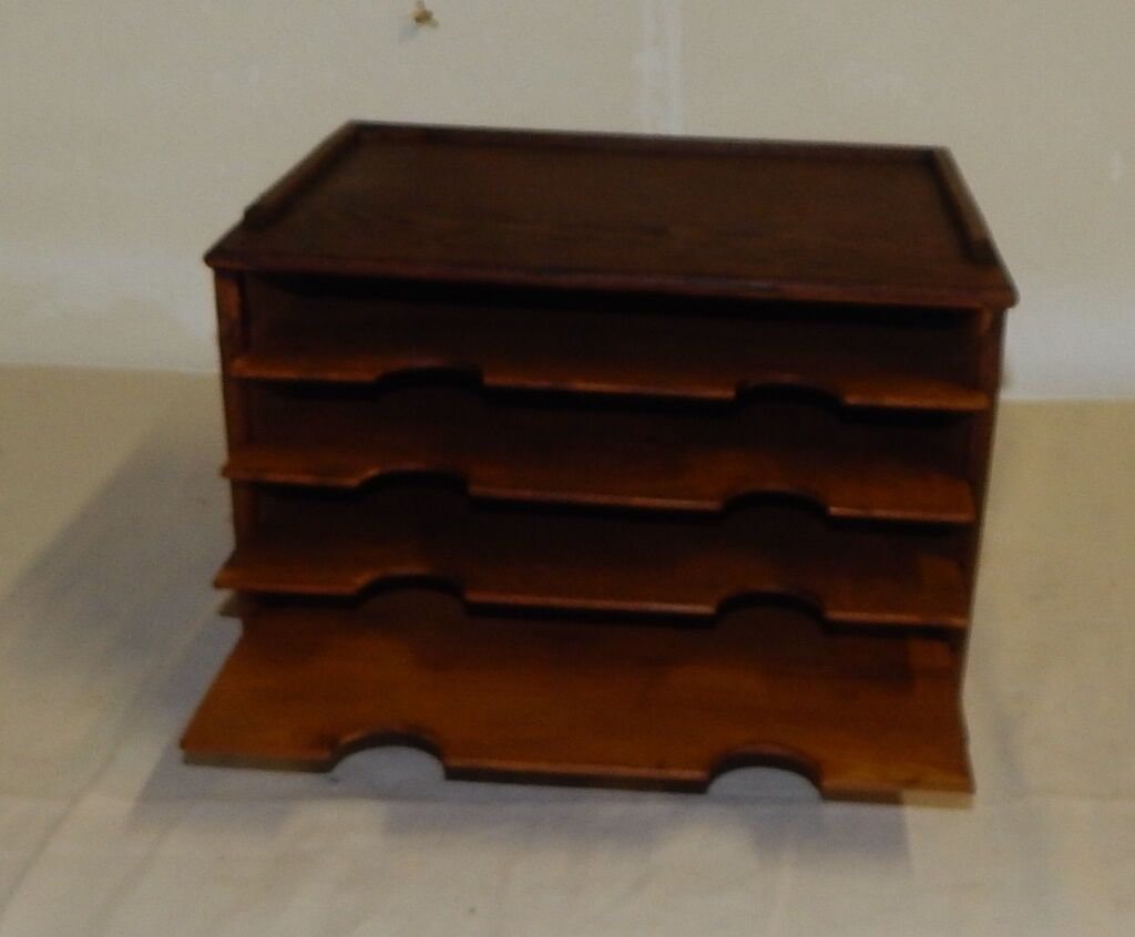 Wooden desk sorter binder to pose