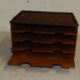 Wooden desk sorter binder to pose