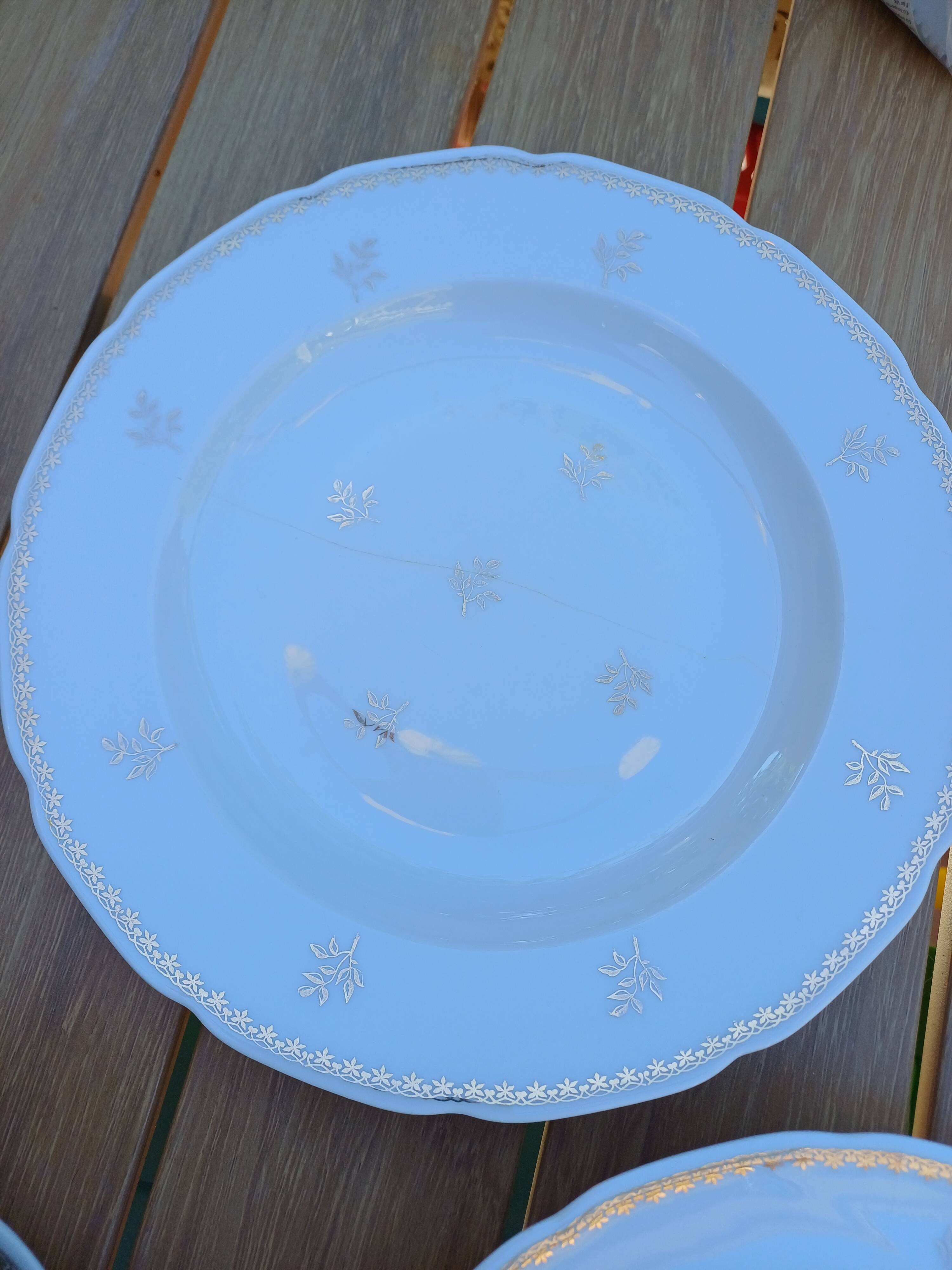 A lot of old white and gold porcelain plates T de F.