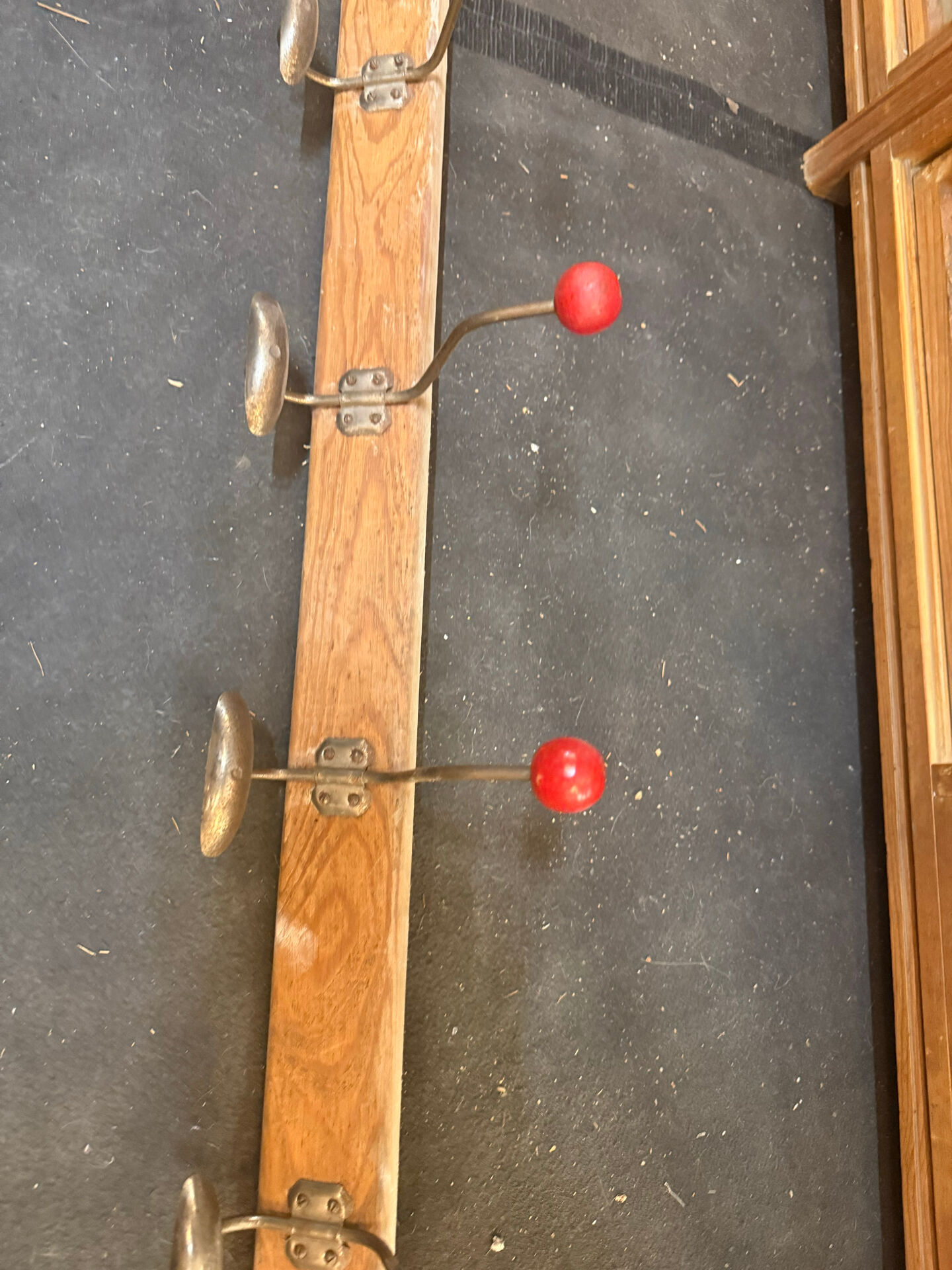 school coat rack / changing room with 10 red ball hooks