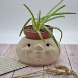Cache pot visage