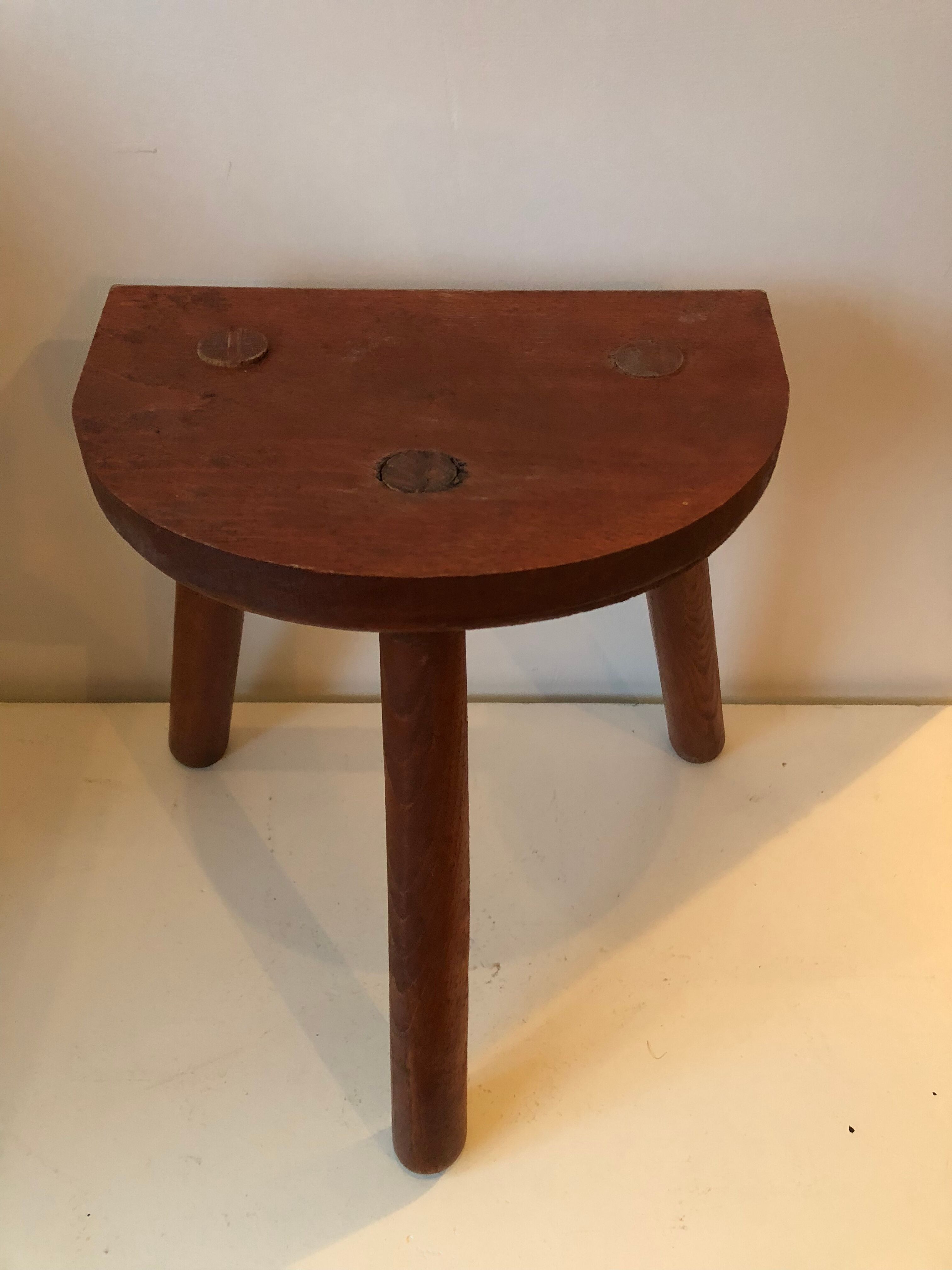 Old wooden tripod stool