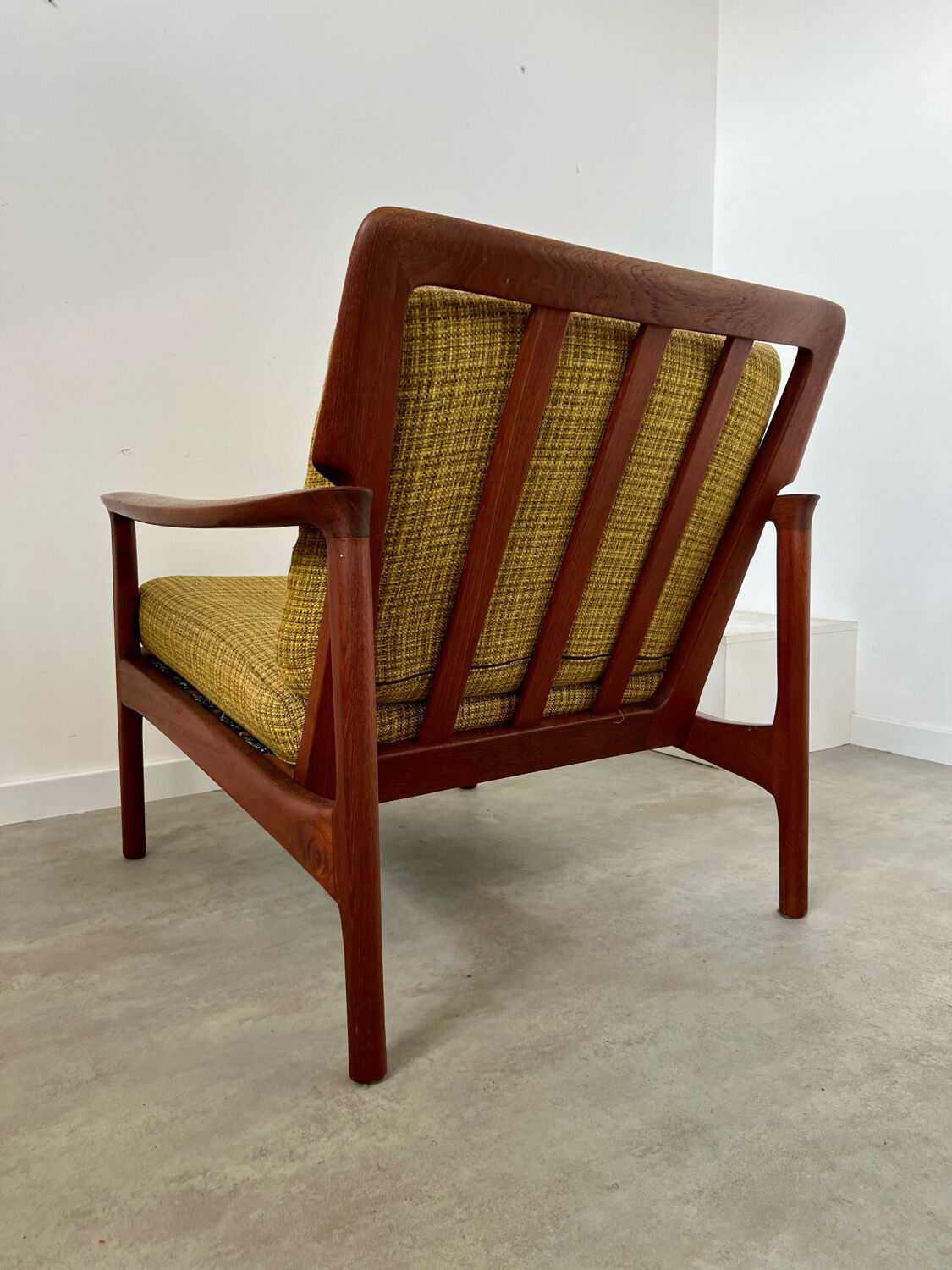 Old Scandinavian design armchair in vintage teak year 60
