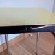 Yellow formica and chrome metal barstool