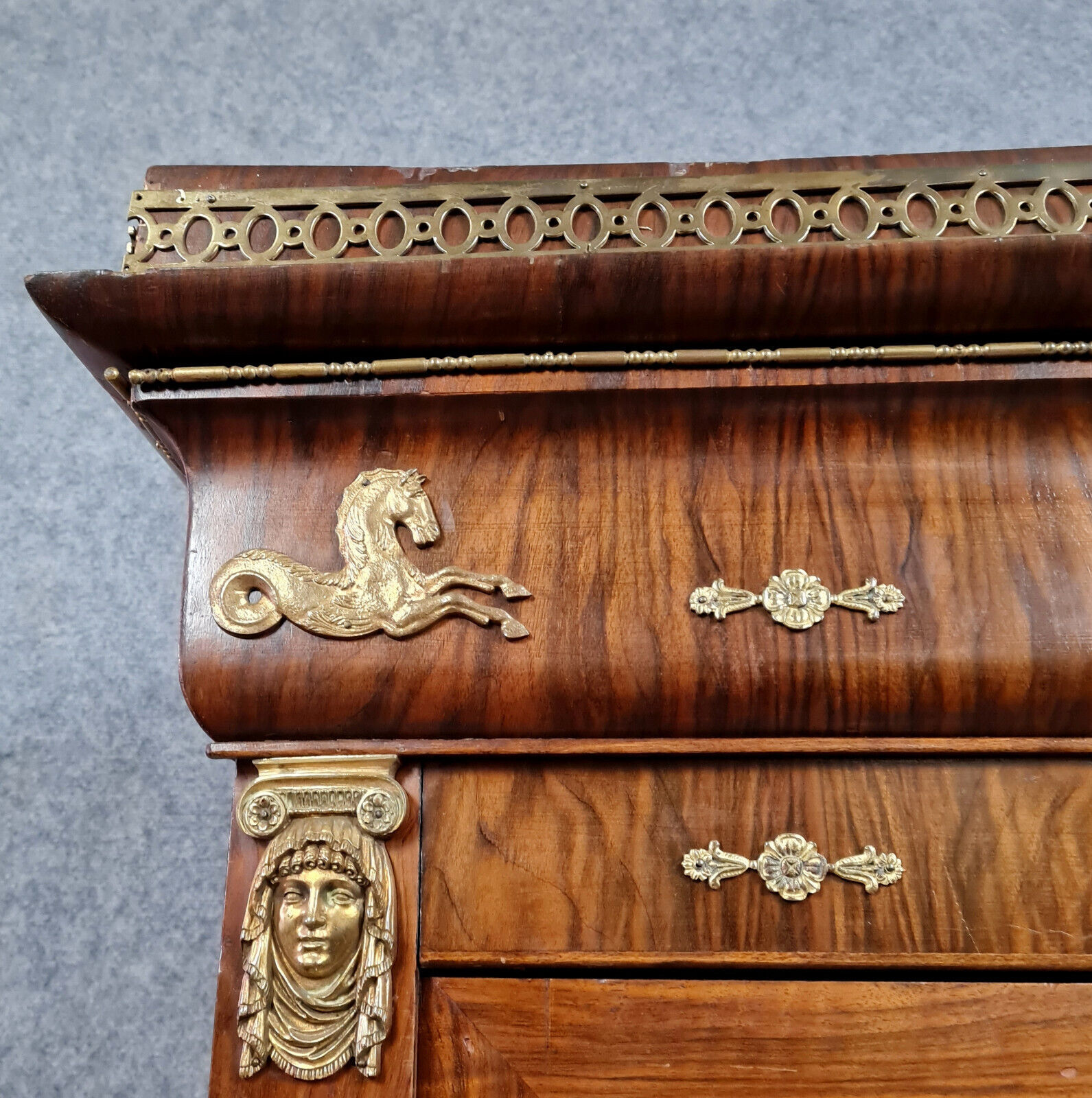 Louis Philippe period wardrobe (nineteenth) entirely covered with gilded bronzes