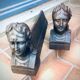Pair of cast-iron chenet characters with laurels
