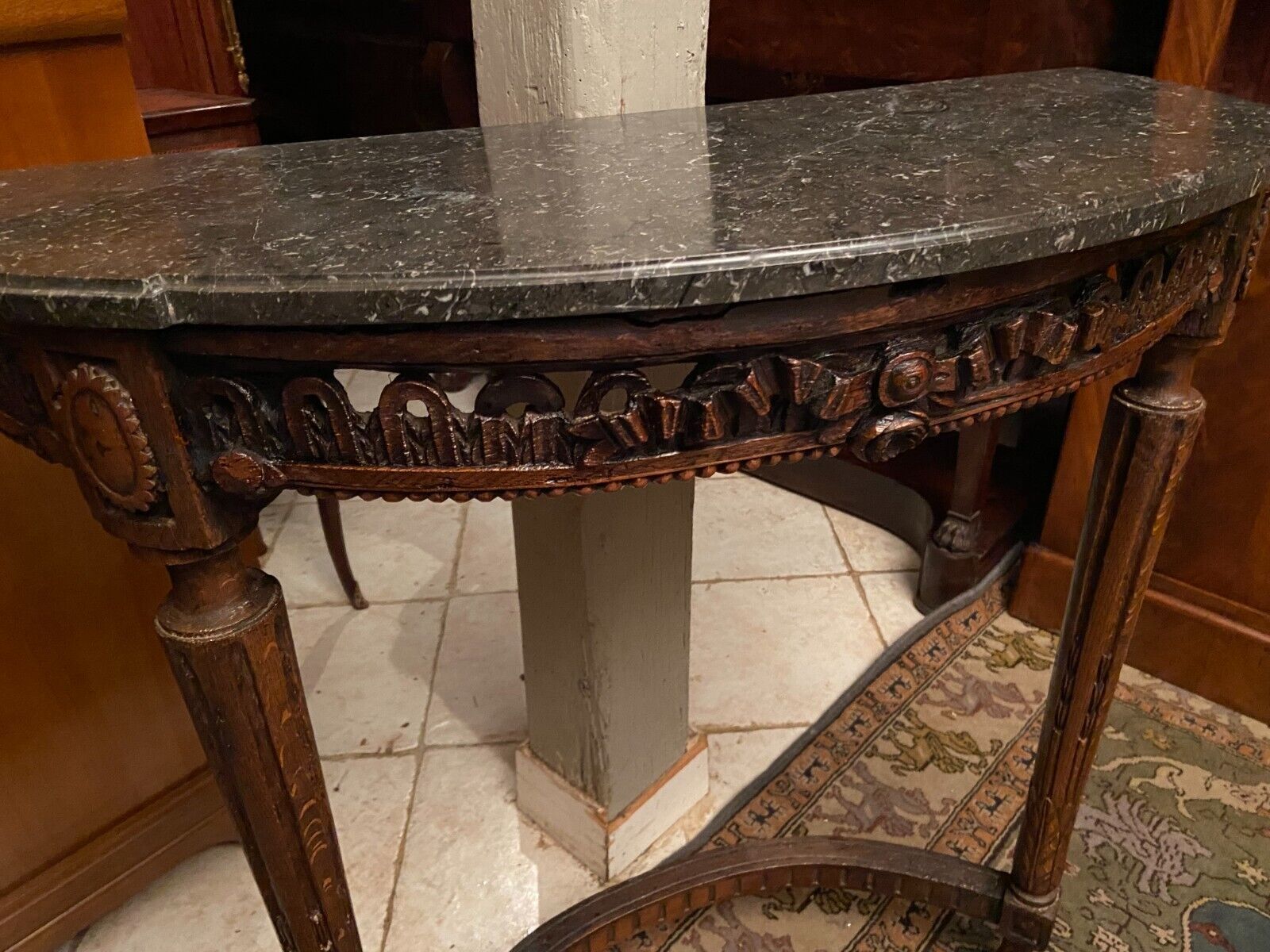 Half-moon console eighteenth century solid oak with carved decoration Louis XVI era