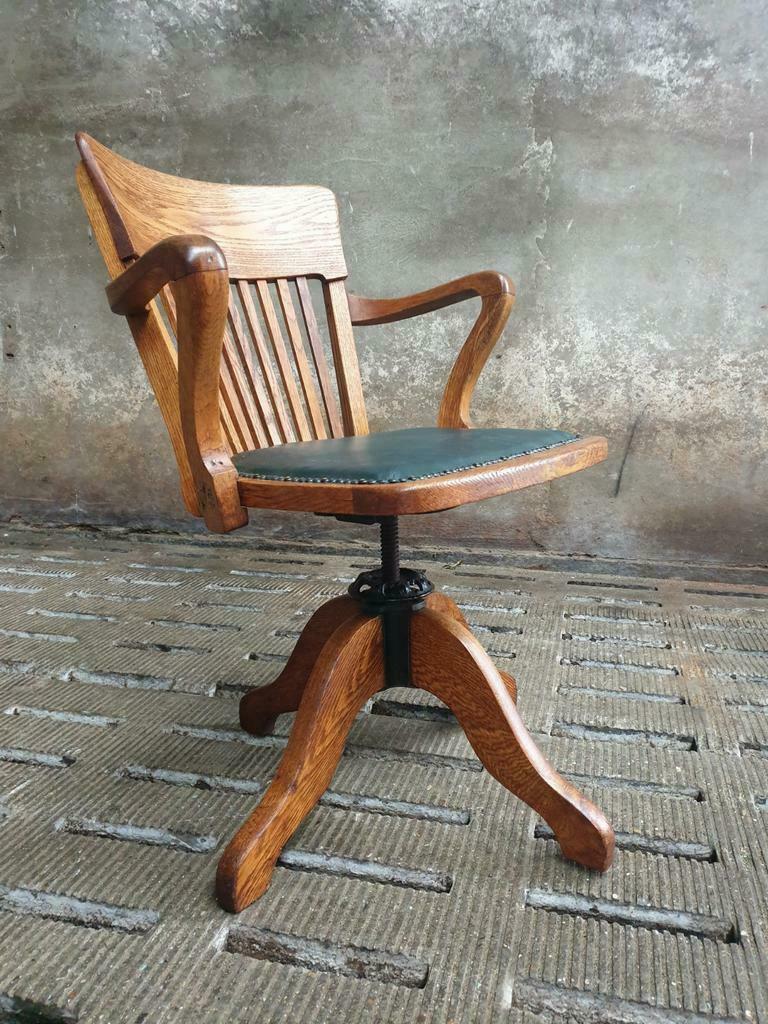 Antique office chair oak adjustable with green leather