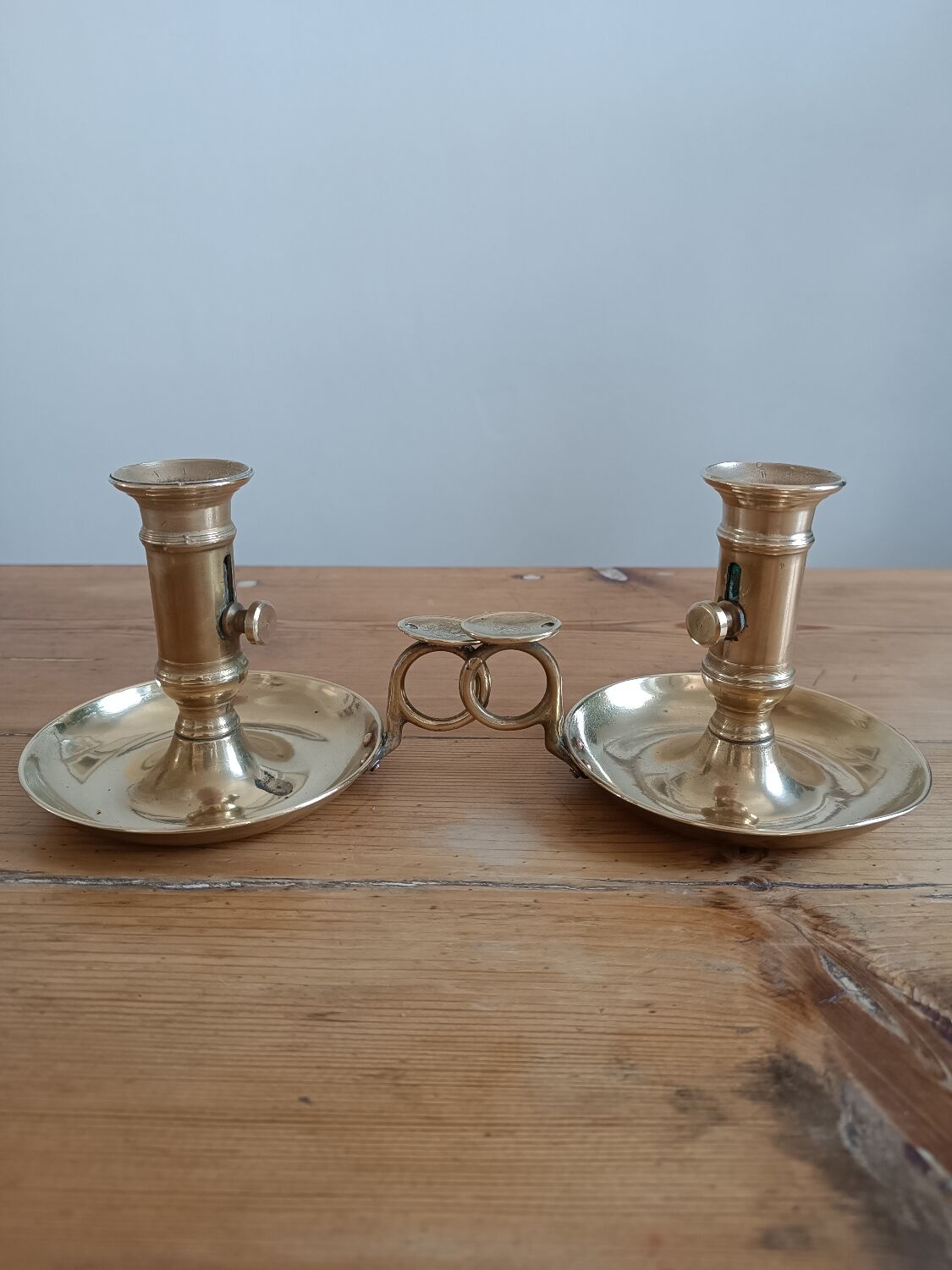 Duo of gilded brass cellar rat candlesticks