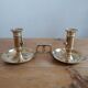 Duo of gilded brass cellar rat candlesticks