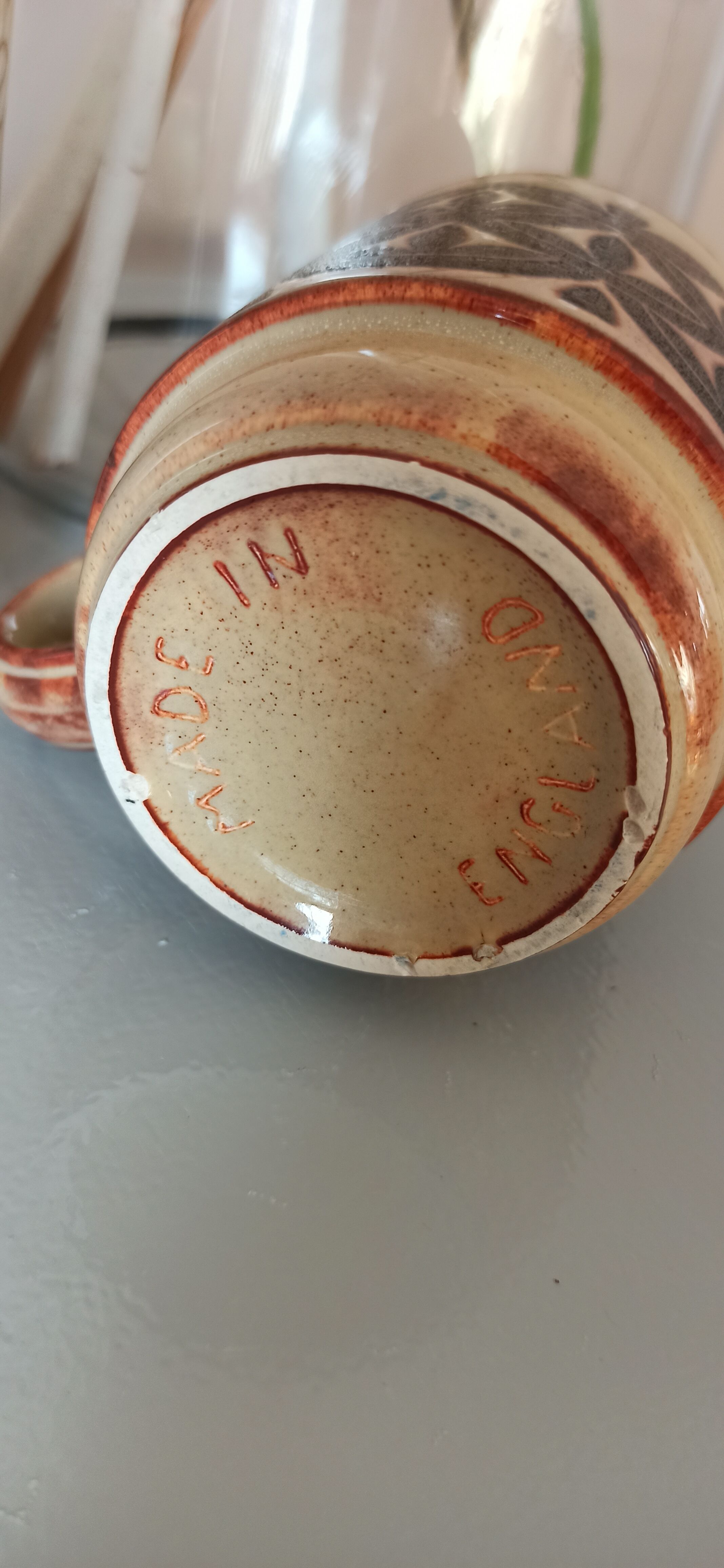 Coffee pot and mug cup in sandstone