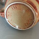 Coffee pot and mug cup in sandstone