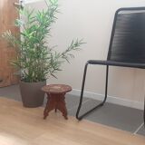 Carved wooden hunting stool decorated with vines