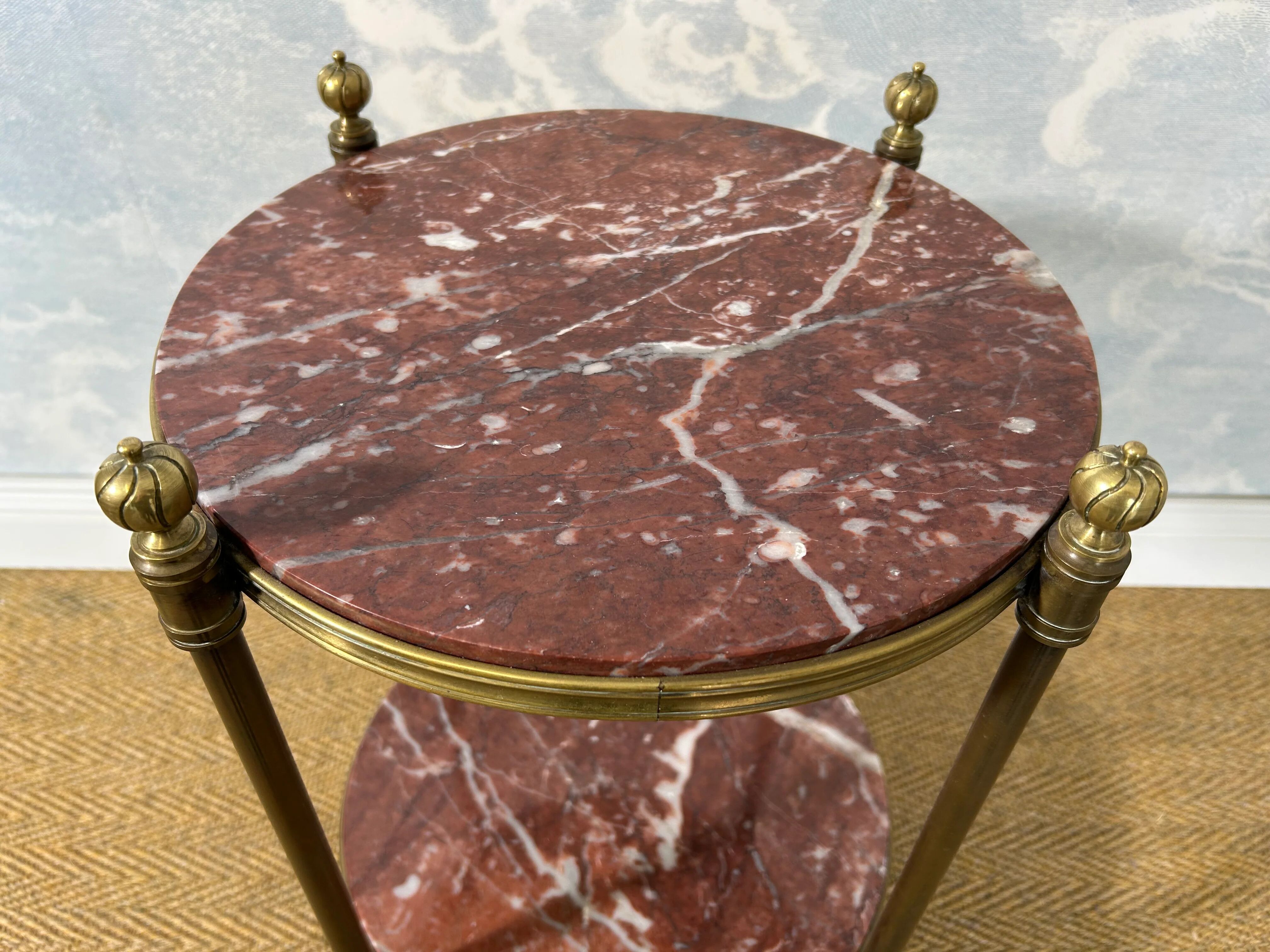 Two-tiered gueridon in Emperador marble on a brass structure, 1970s.