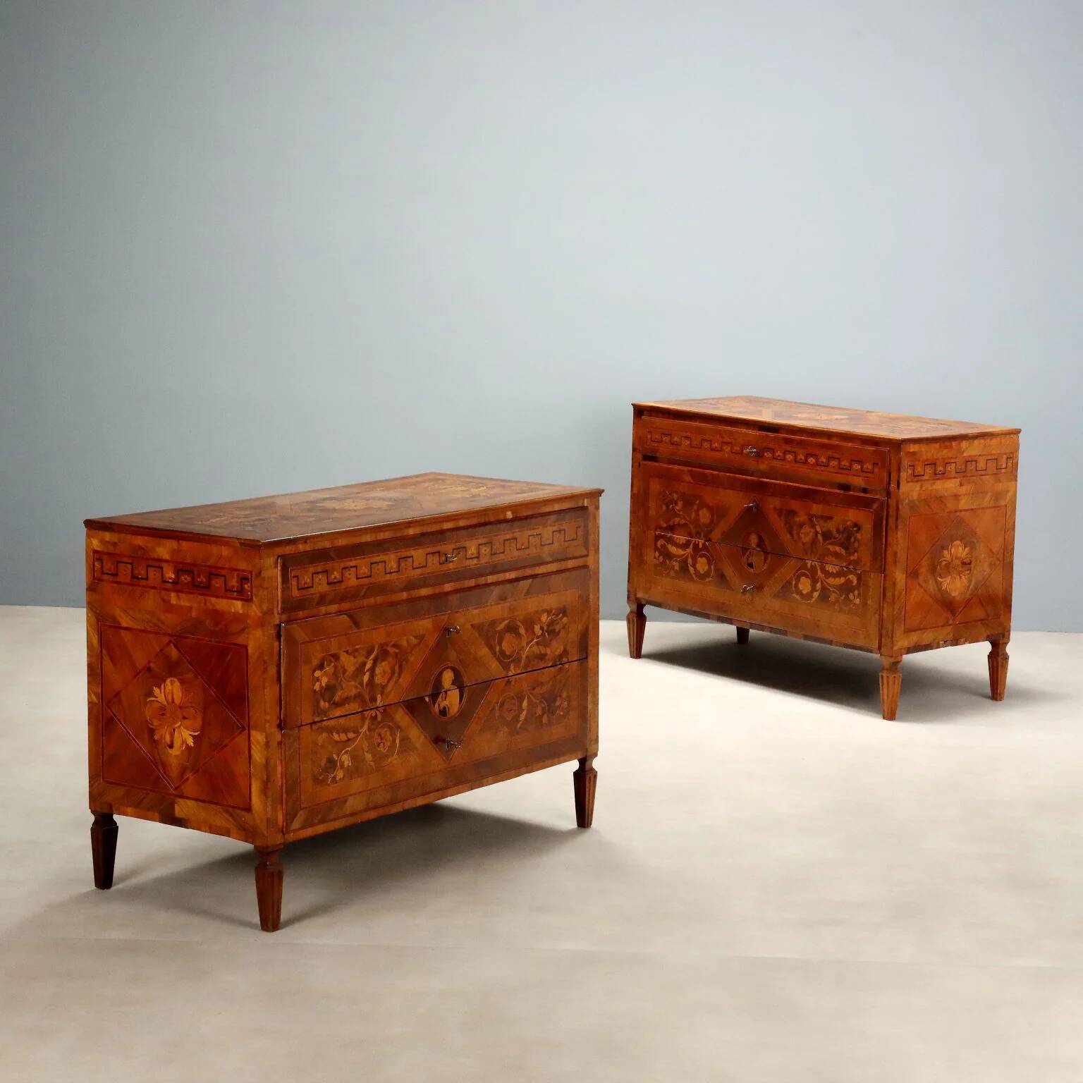 Pair of antique neoclassical walnut commodes from the 18th century.