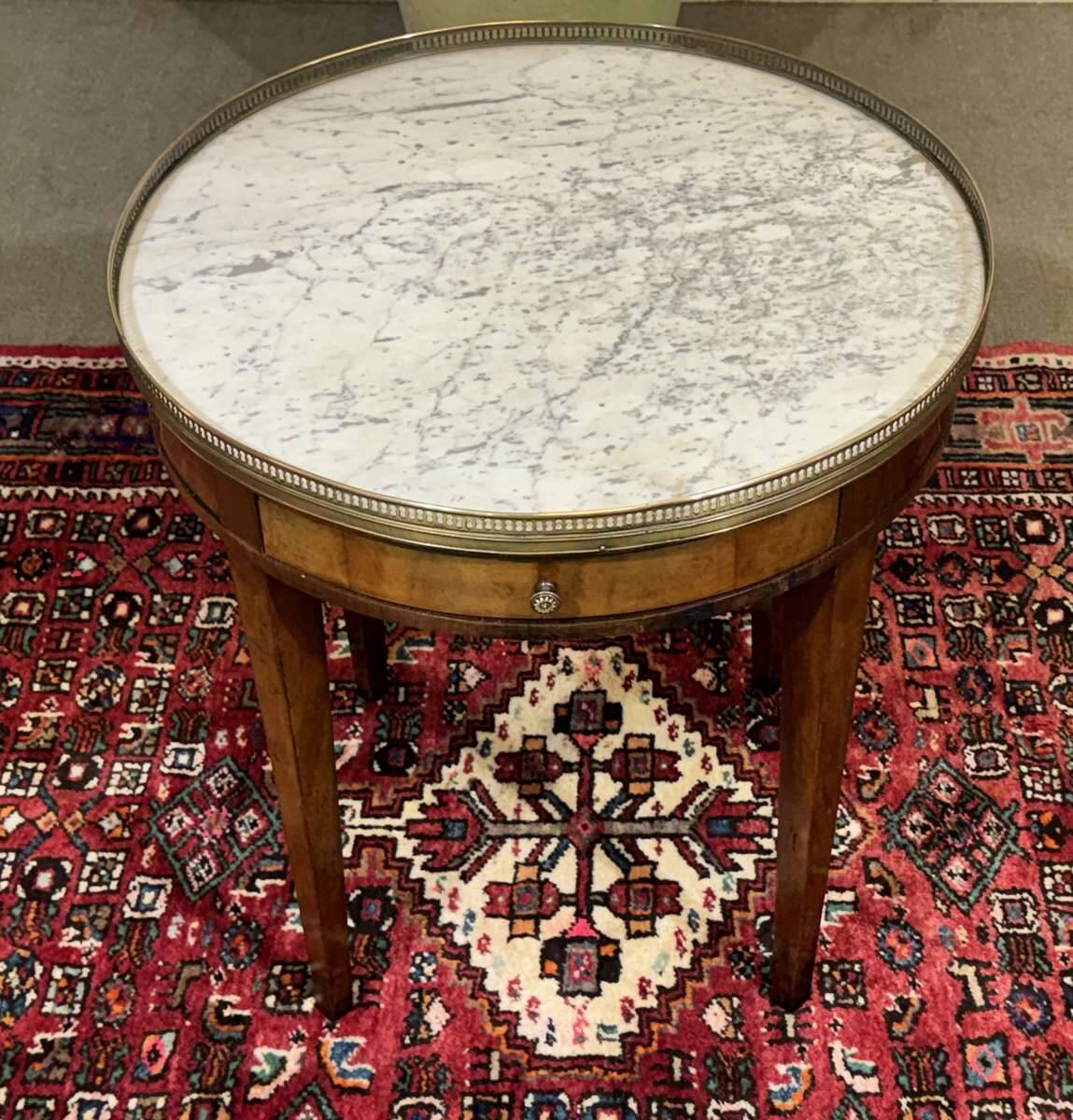 Louis XVI style bouillotte table in mahogany with a white marble top.