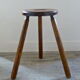 Tripod stool in raw wood with handle