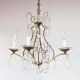 Old French chandelier in gilded brass with tassels