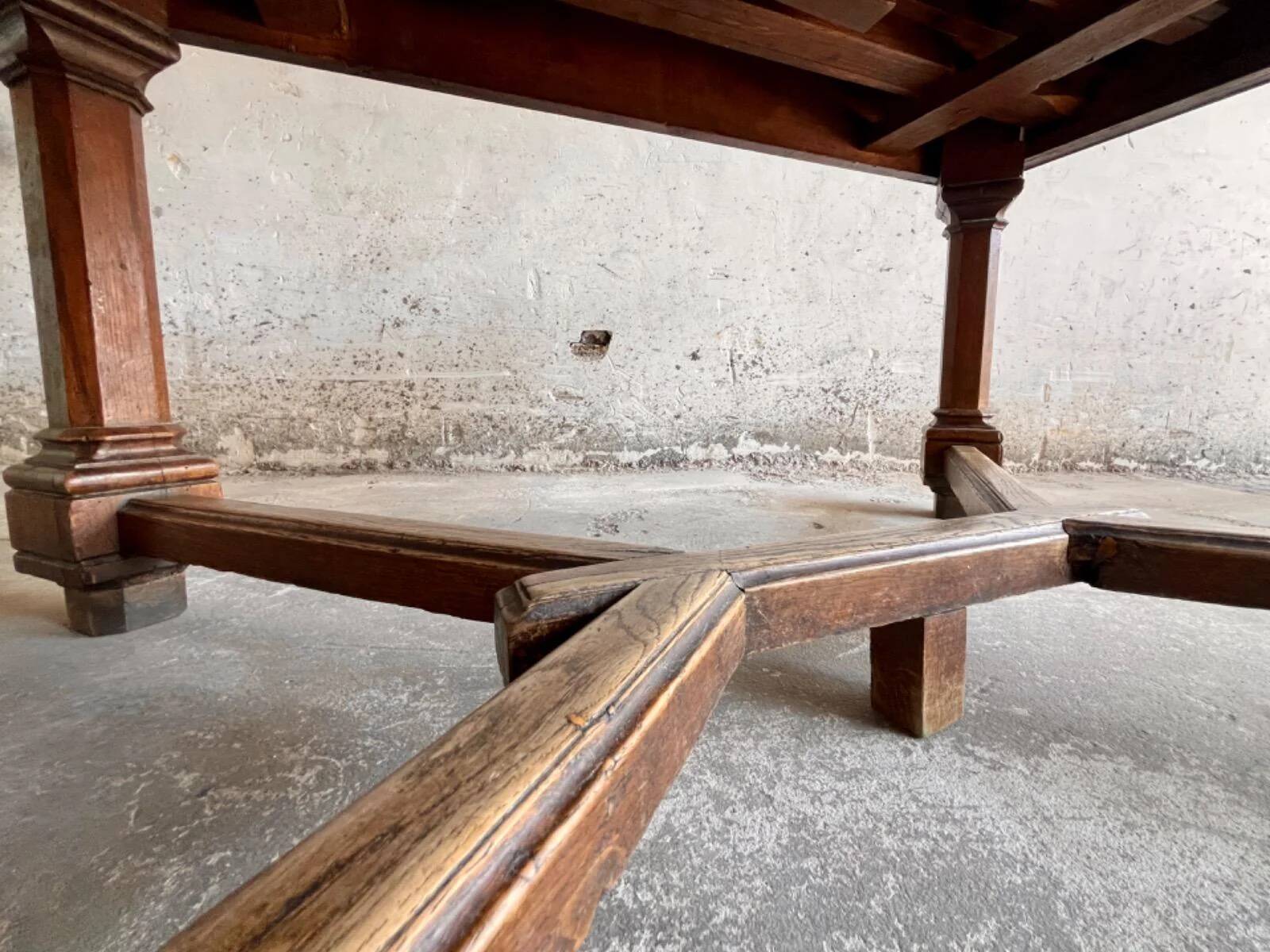 French dining table in Neo-Renaissance style with cross legs.