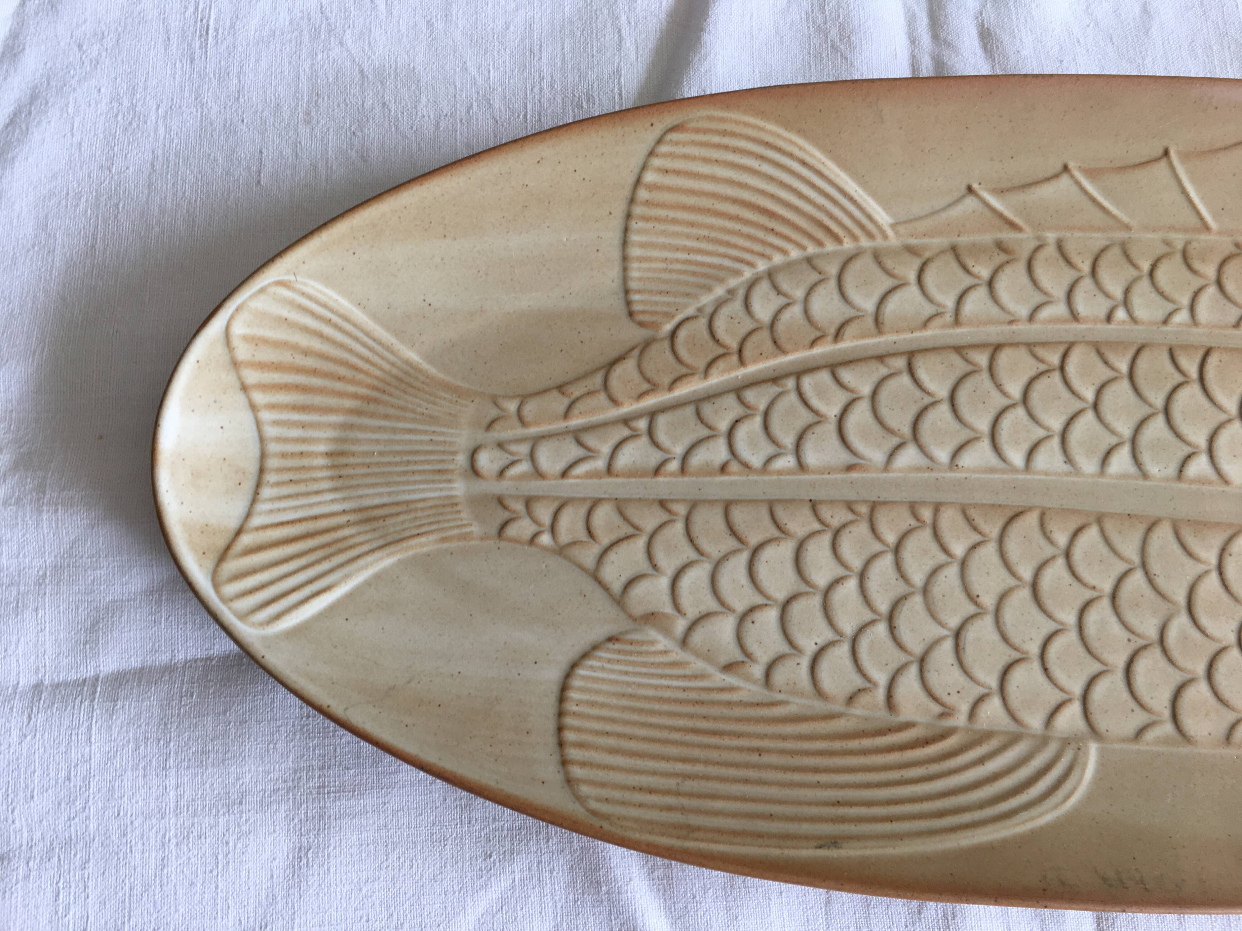 Very large fish dish stamped “Grès CNP Village France”