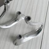 Pair of designer candlesticks in chromed metal