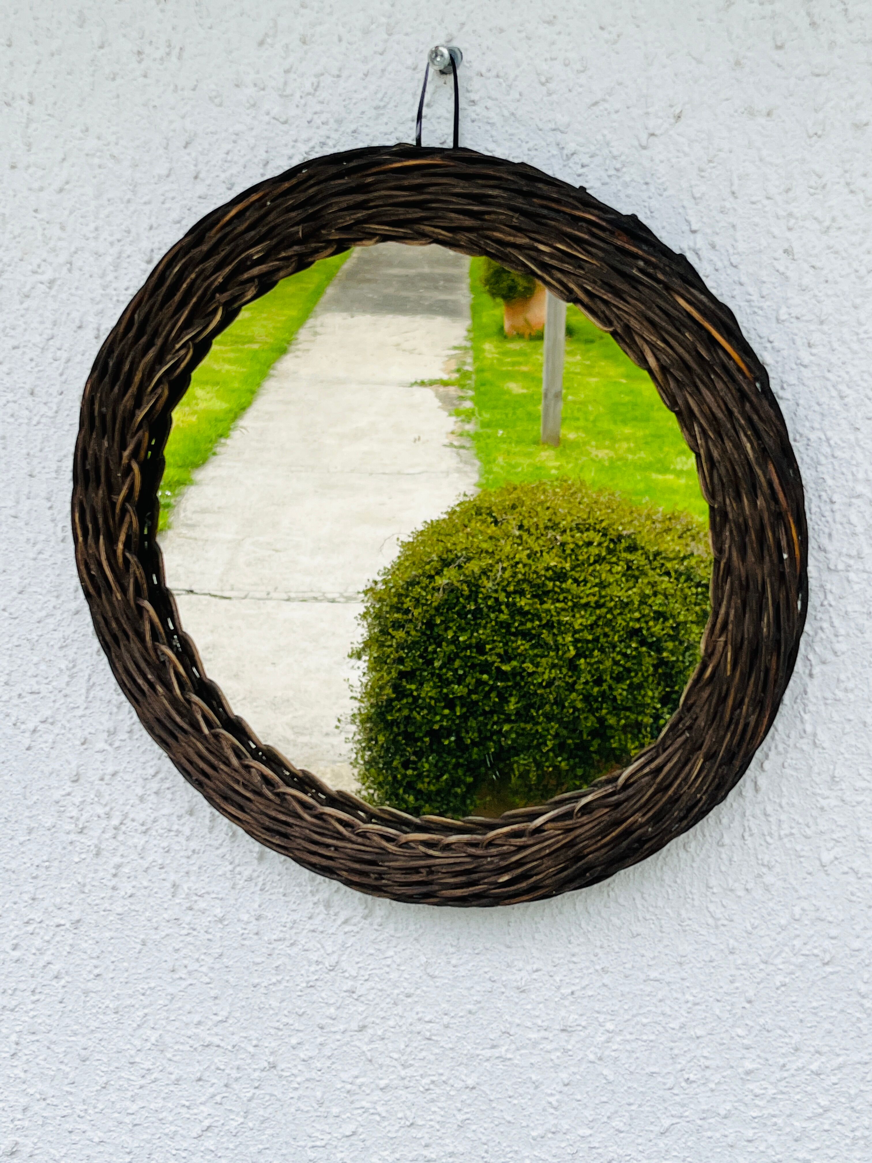 Vintage sun mirror in woven wicker