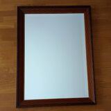 Beveled mirror, carved wood, gilded outline. 58x78x3 cm