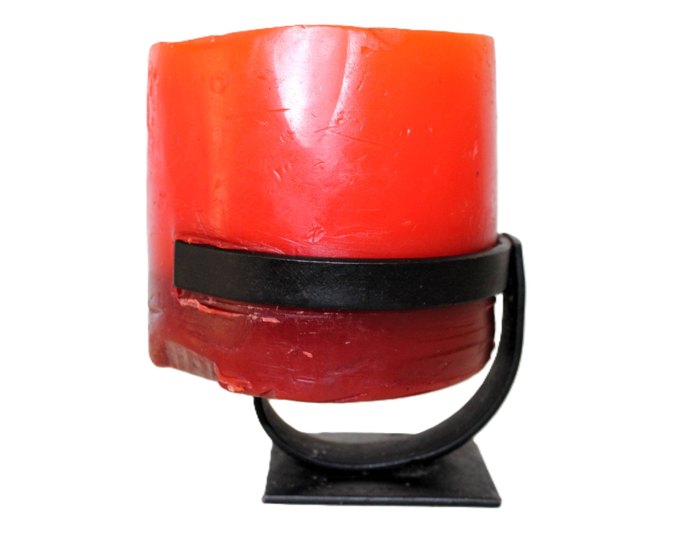 1970 wrought iron candlestick with its period coloured candle.