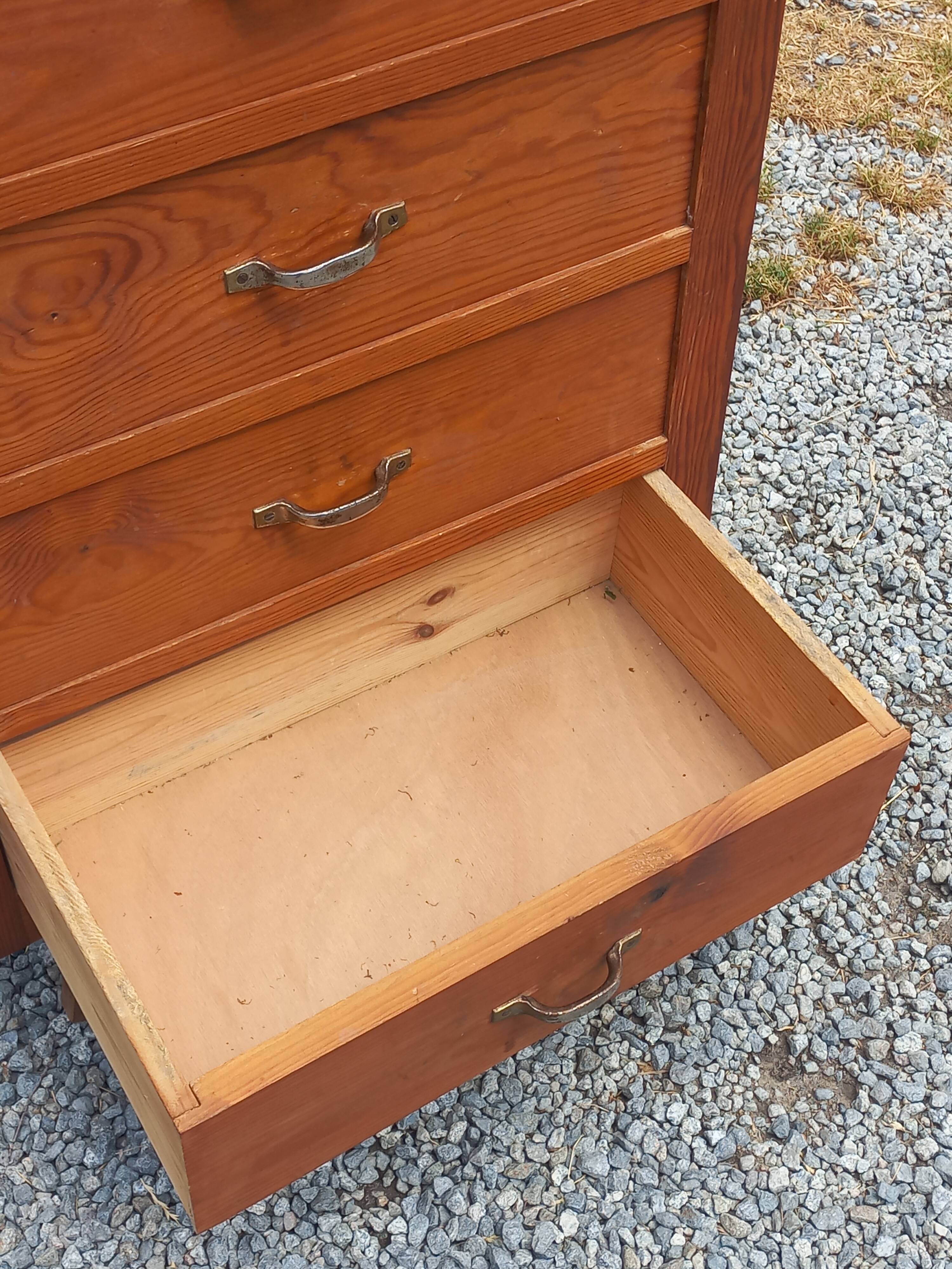 Vintage 1950s chest of drawers with tapered legs and 5 drawers.