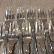 12 silver-plated metal cake forks by Argental silversmiths with a decorative pattern