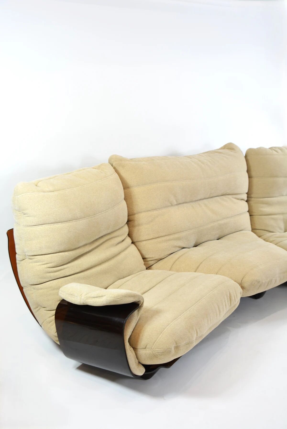 Marsala armchair and its light beige Ligne Roset footrest.
