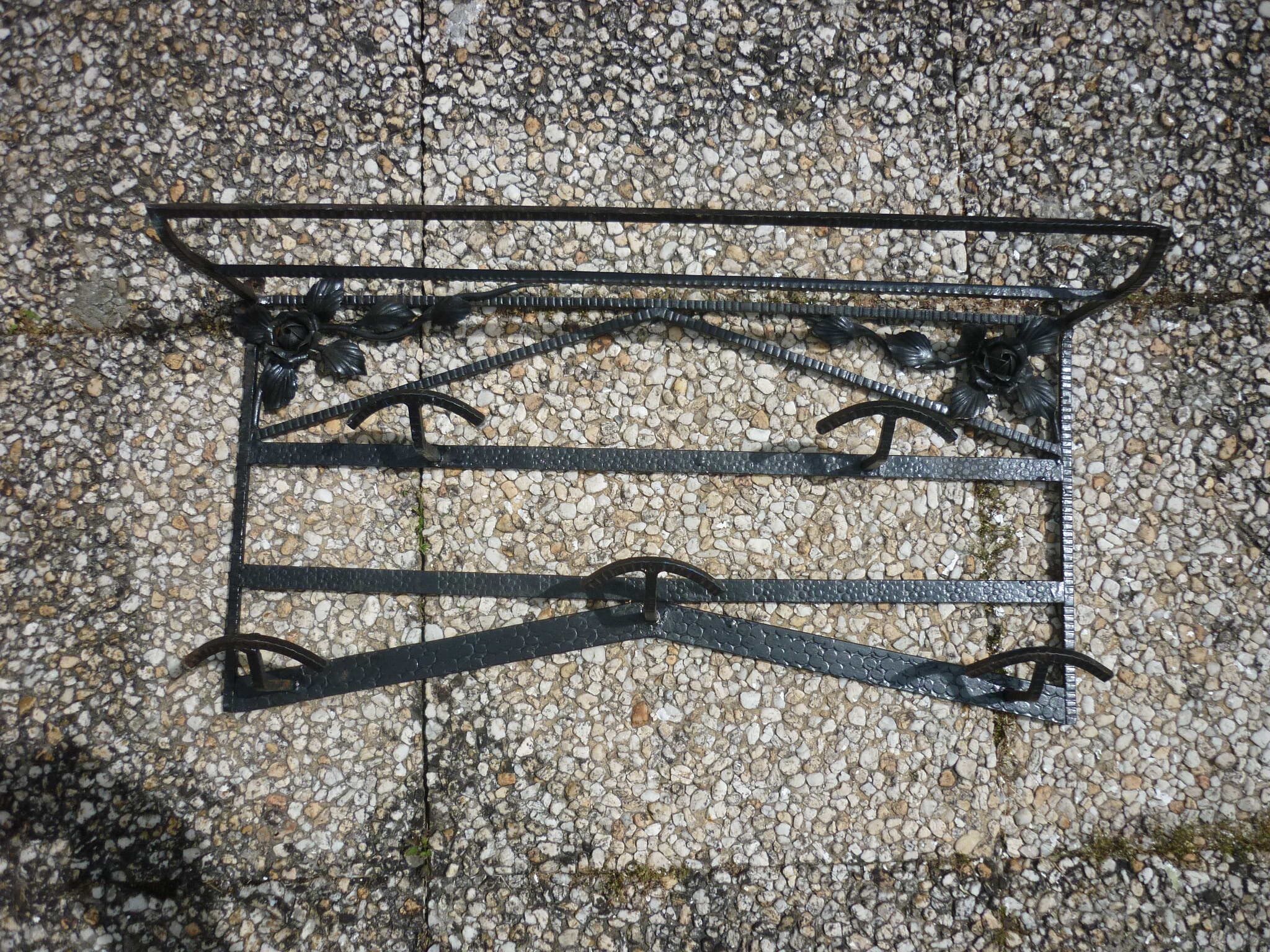 Wrought iron vest and a shelf with a hat