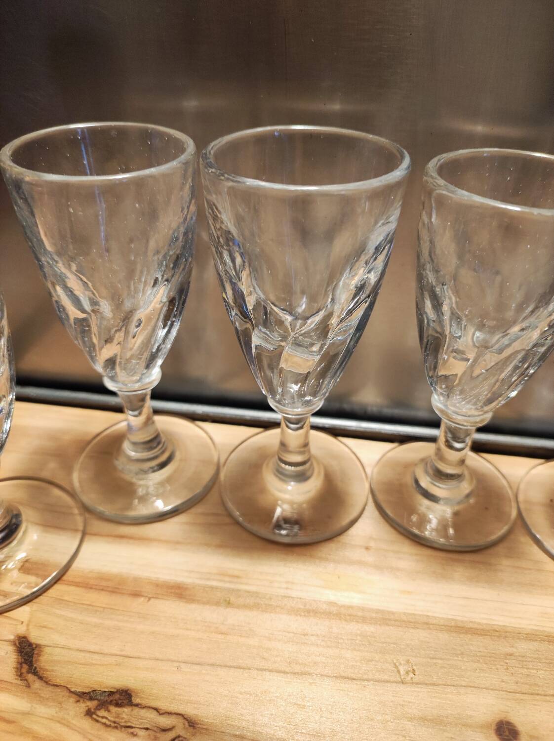 12 small twisted bistro glasses, 19th century