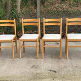 4 solid wood and white leather chairs