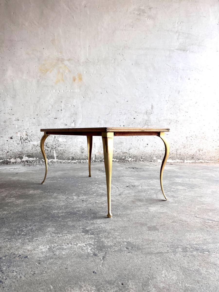 Vintage coffee table with gold-gilded legs and light brown wood veneer geometric inlaid top