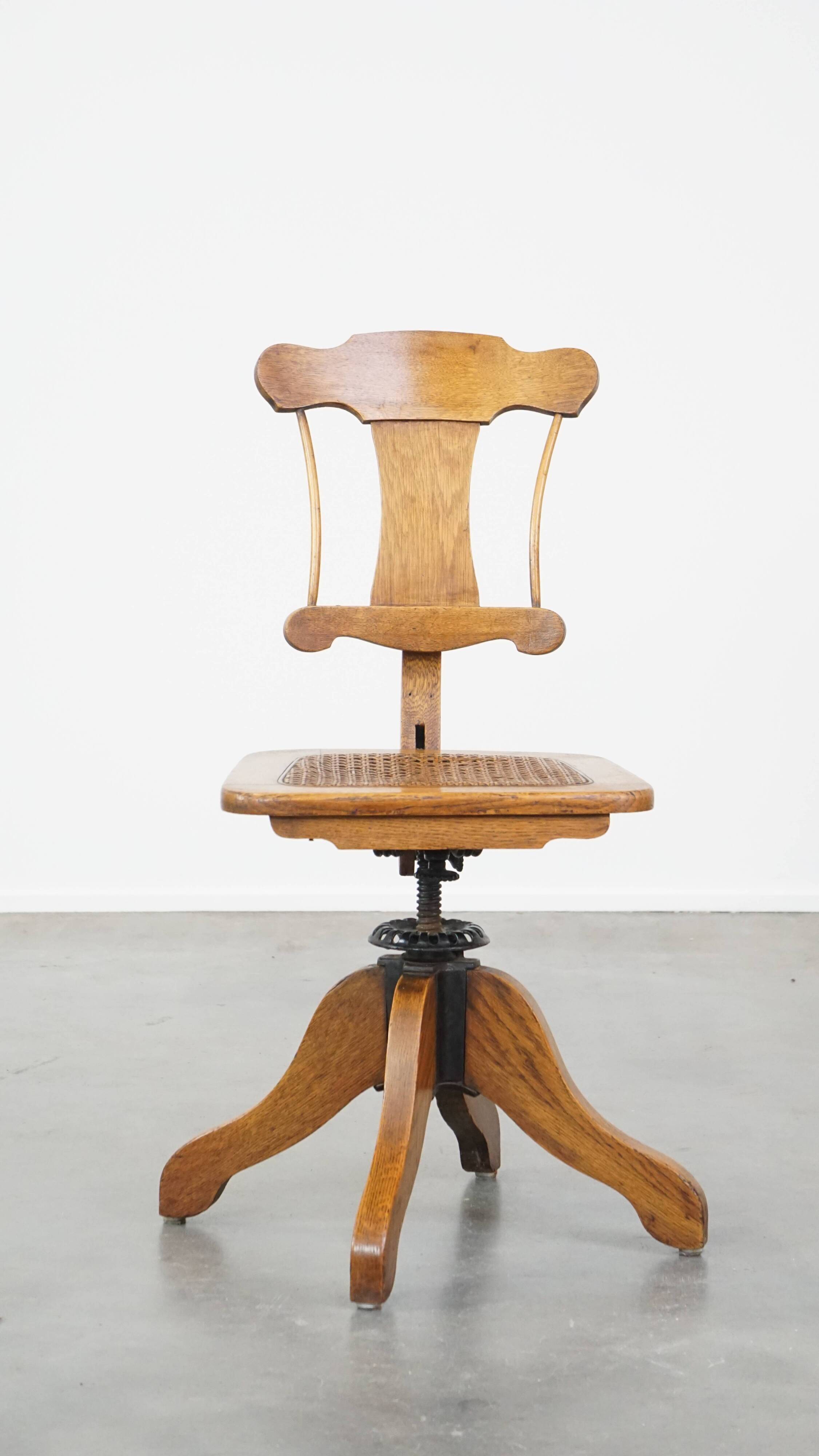 Antique late 19th century English office chair with reclining backrest and height adjustable