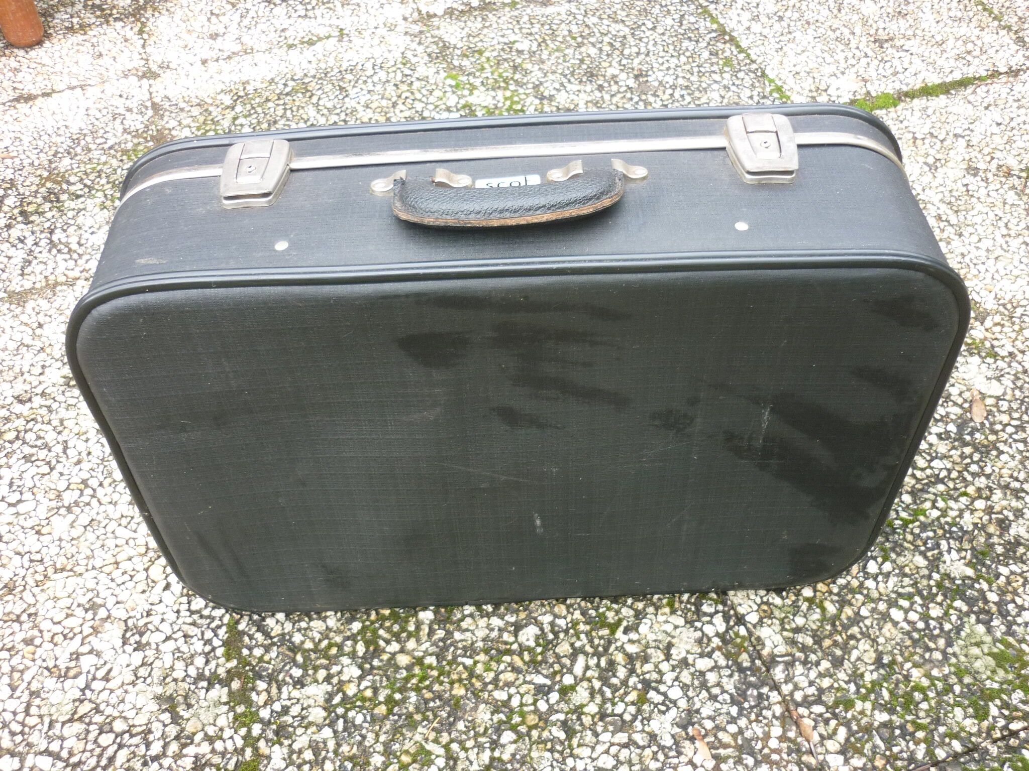 Black antique suitcase, registered trademark scot
