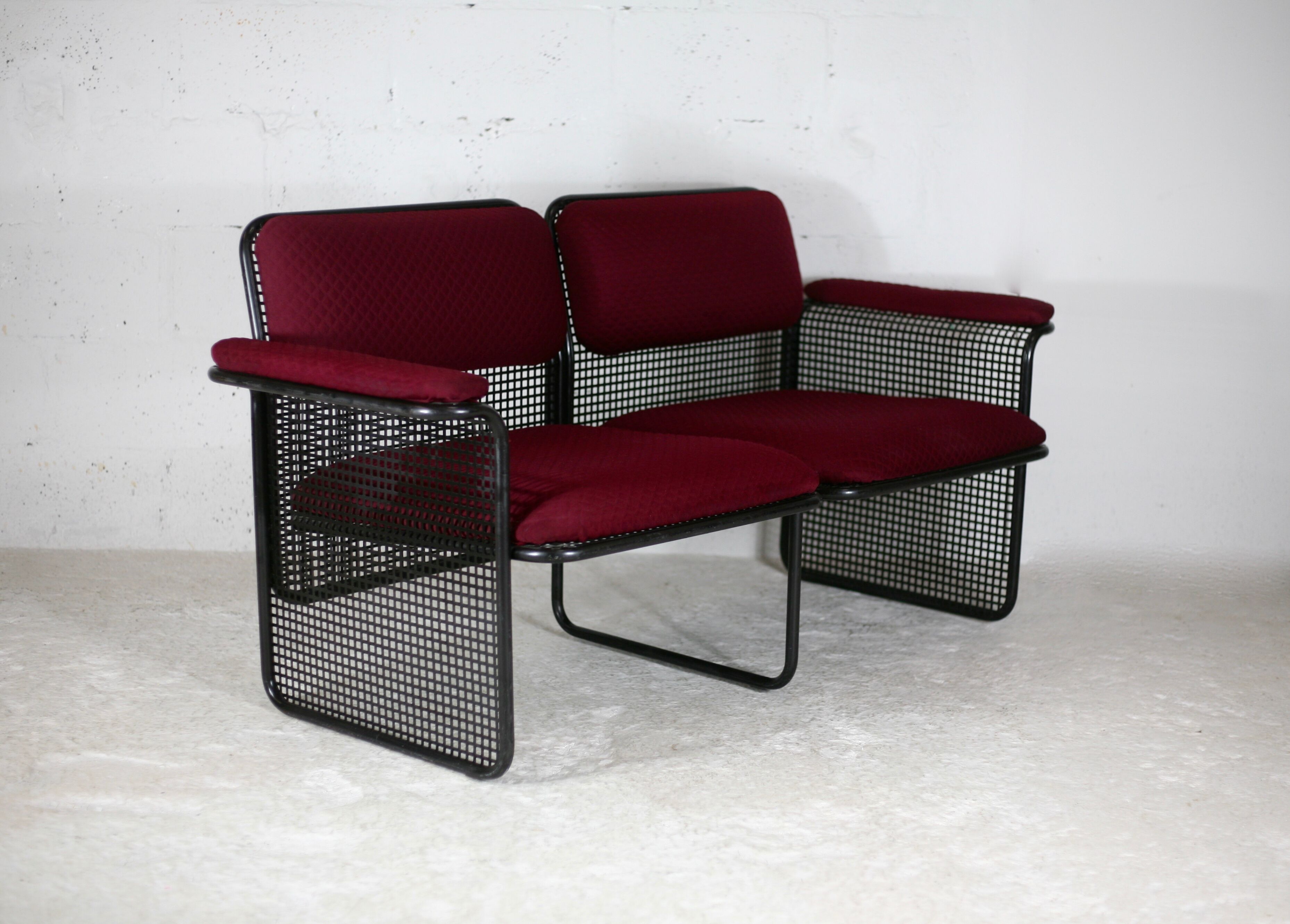 Black honeycomb steel sofa, burgundy fabrics, Italy, circa 1970
