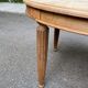 Large stripped solid oak dining table in Louis XVI style with 3 extensions.