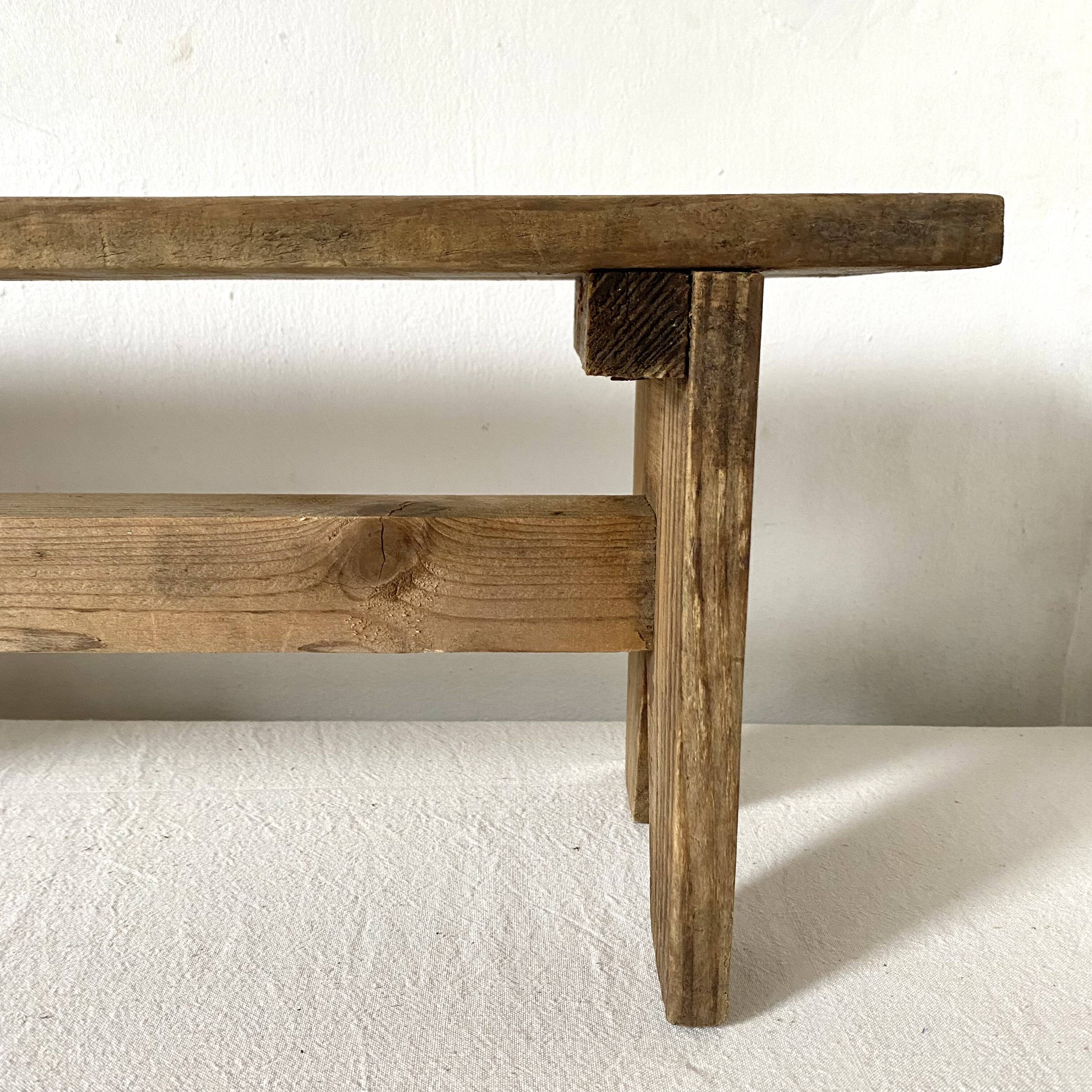 Low stool in raw wood