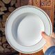 Twelve white porcelain plates