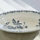 Iron flat plate with a 19th-century bird signed Onnaing "Poppies"
