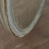 Patinated oval mirror