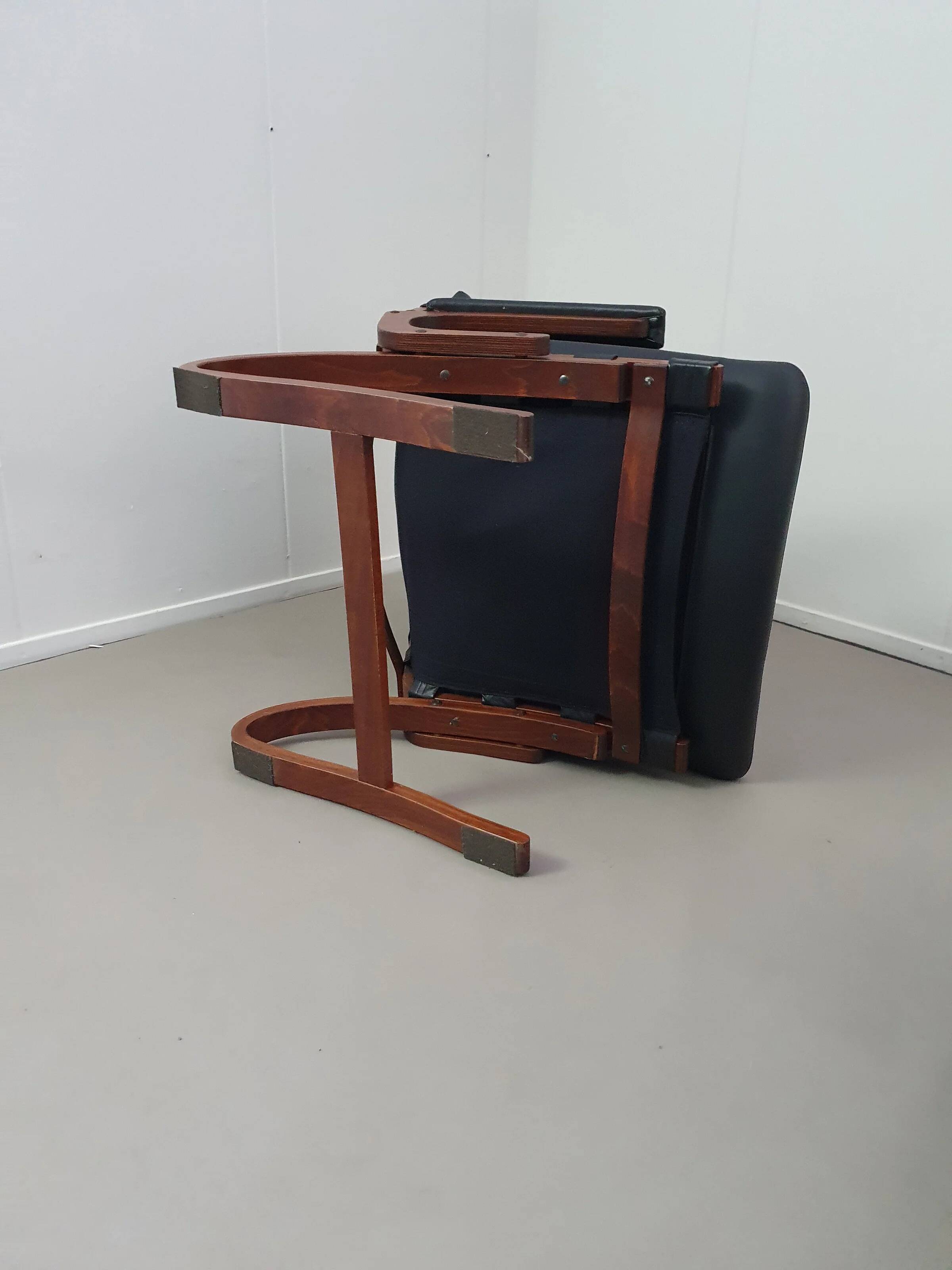 2 x Scandinavian black leather lounge chairs