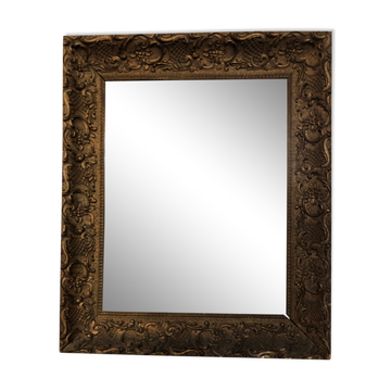 Carved and gilded wooden mirror