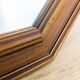 Miroir vintage octogonal en bois massif avec détails sculptés