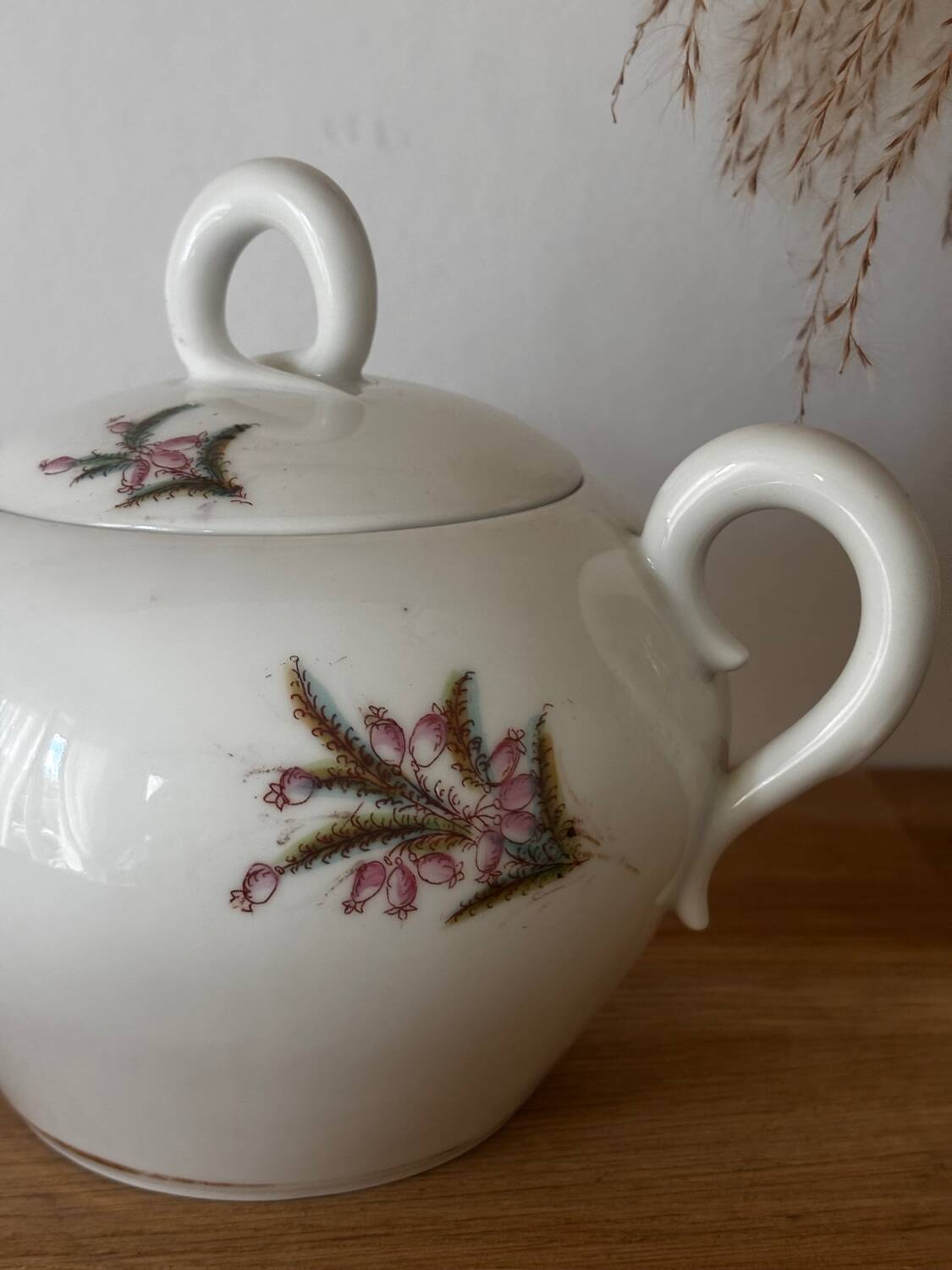 Beautiful vintage porcelain sugar bowl with a floral pattern.